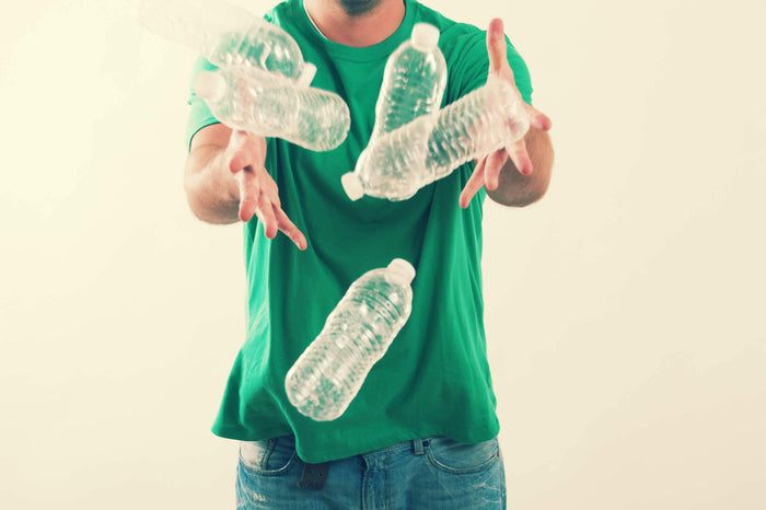 man recycles bottles